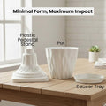 GoHooked 7-inch white marble finish plastic planter with pedestal stand and saucer tray. Modern diamond-cut design.