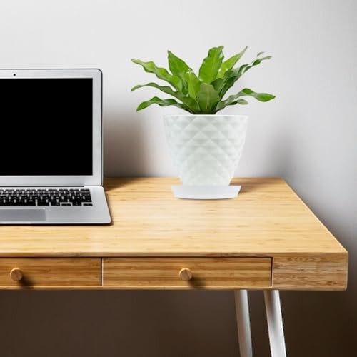 Go Hooked white diamond-patterned plastic planter pot with saucer on a wooden desk next to a laptop.