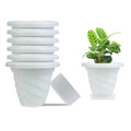 GoHooked white plastic planter pots set of 6 with saucers, modern twister design for indoor/outdoor plants.