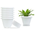 GoHooked white plastic planter pots set of 6 with saucers, one pot with a plant. Modern design.