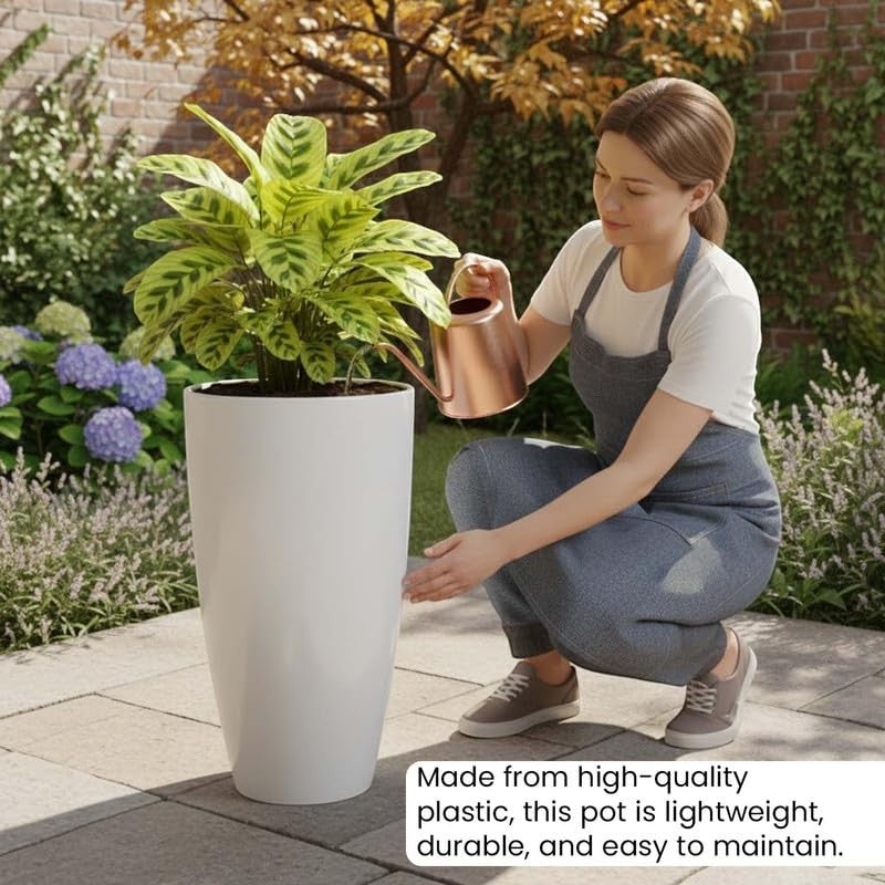 Go Hooked tall white plastic planter with a plant, a woman waters it with a copper watering can.