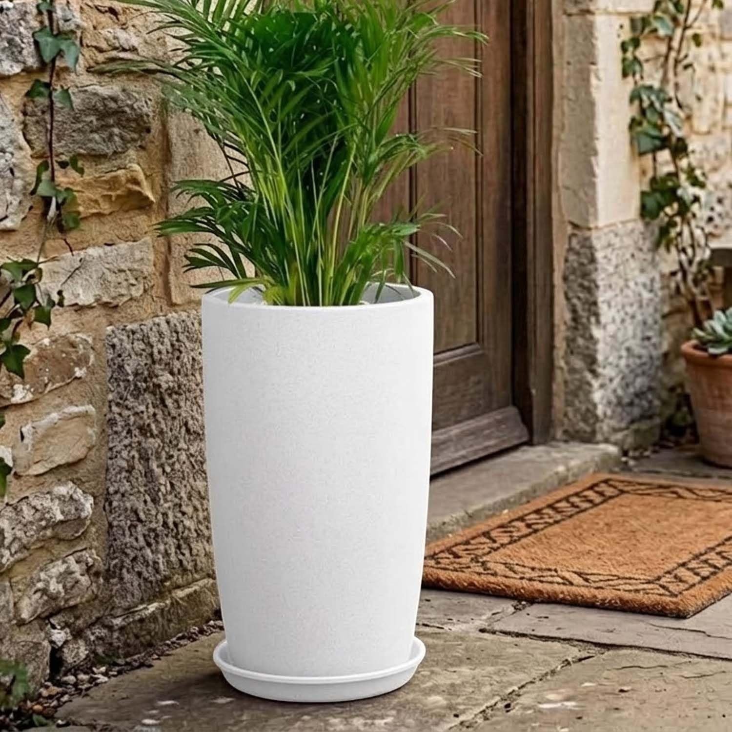 GoHooked white plastic planter with a matching saucer, holding a green plant. Ideal for indoor or outdoor use.