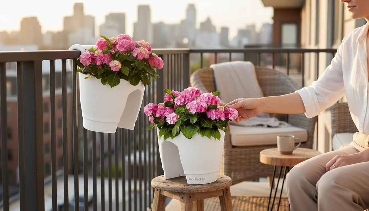 GoHooked white plastic railing planters (12 inch, set of 2) with pink hydrangeas on a balcony.