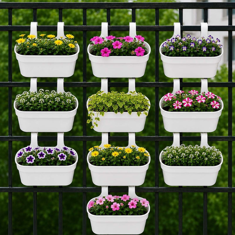GoHooked white plastic railing hanging planters filled with colorful flowers and greenery on a black fence.