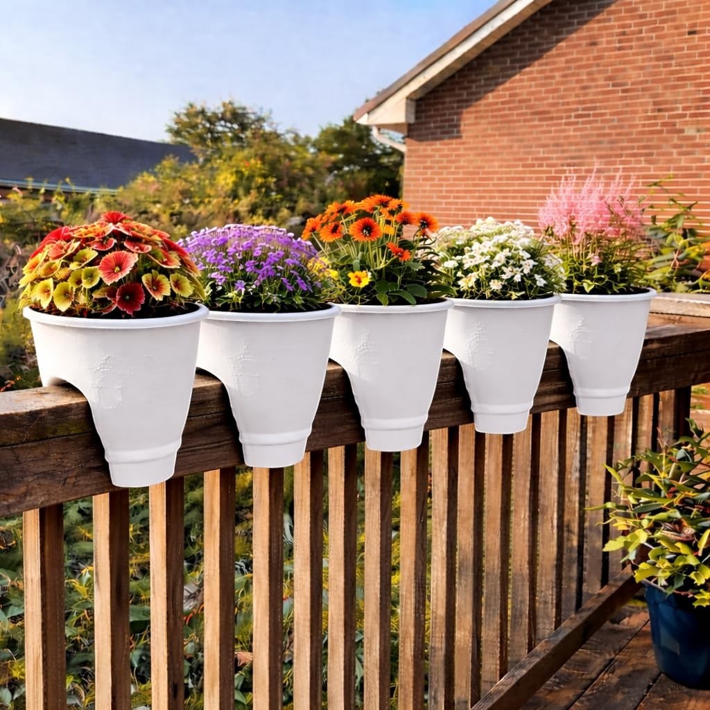 GoHooked white plastic railing pots, 12 inch, set of 5, holding colorful flowers on a wooden deck railing.