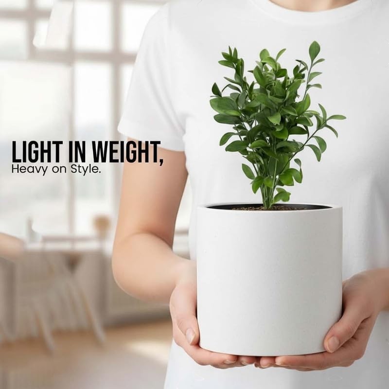 Go Hooked 12-inch white polymer round planter with a drainage hole holding a green plant.
