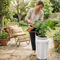 Go Hooked tall white polymer planter with marble texture, 24 inches, for indoor/outdoor use.
