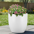 GoHooked Pluto 22-inch white polymer planter pot with pink flowers. Modern round design, lightweight and durable.