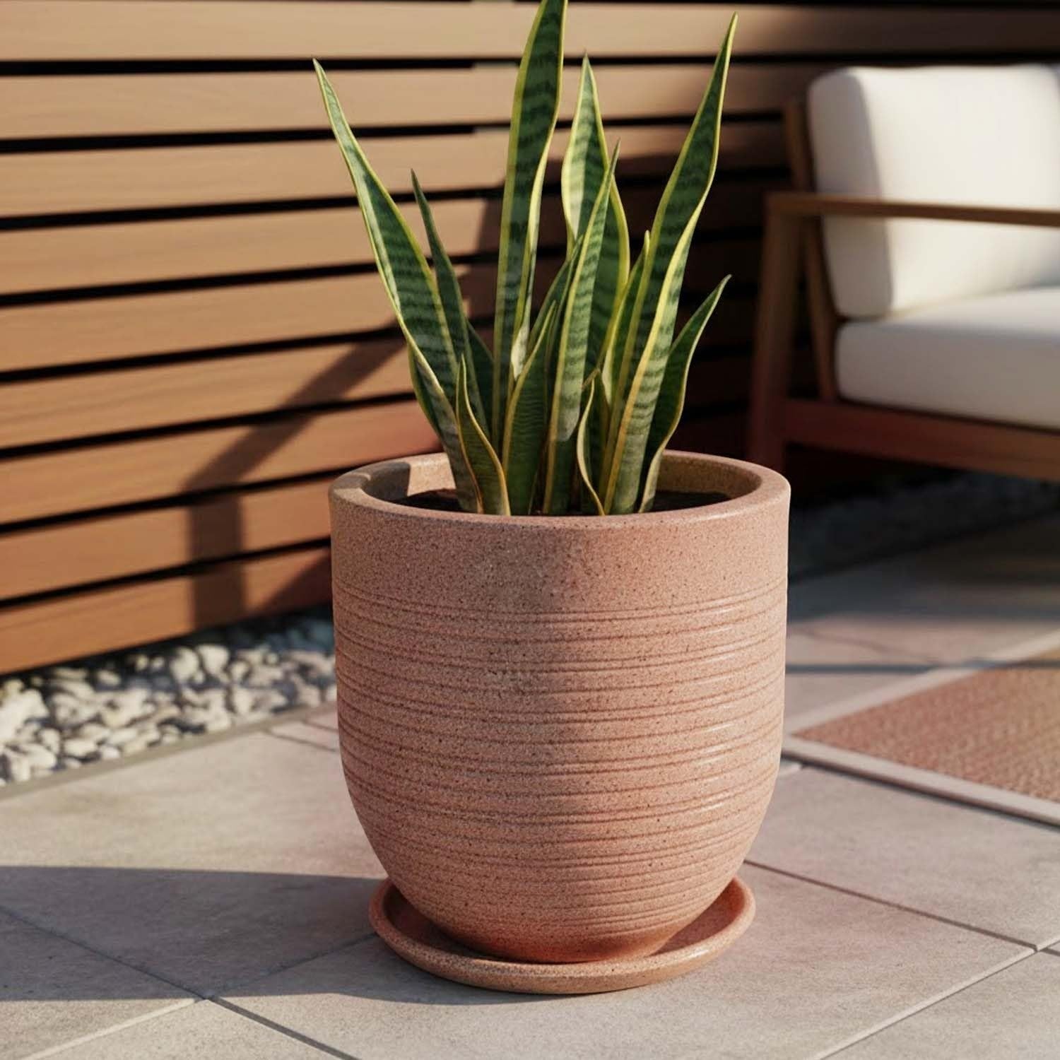 GoHooked 10 inch white polymer planter pot with textured ribbed design and matching saucer, holding a snake plant.