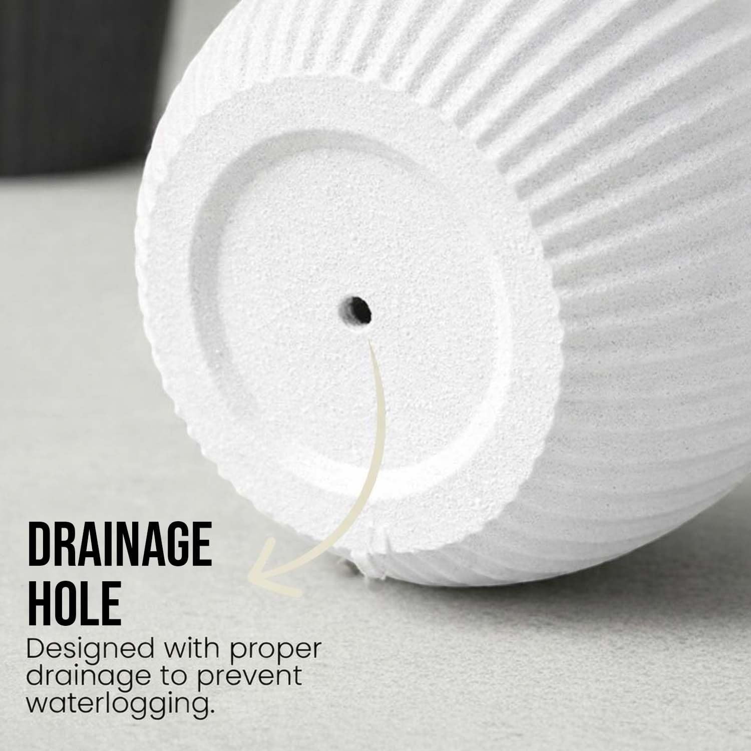 GoHooked white polymer planter with ribbed design and drainage hole for indoor/outdoor plants.