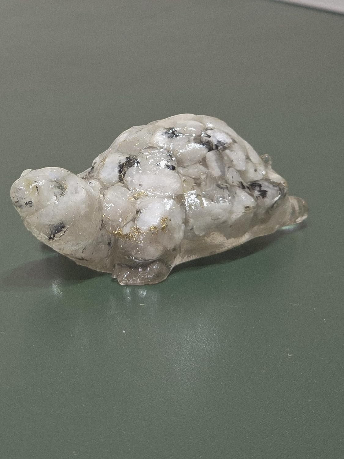 GoHooked white snow quartz crystal tortoise figurine with black speckles and gold flecks, for peace and positivity.