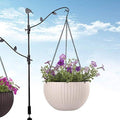 GoHooked white rattan woven plastic hanging planter with purple flowers, 7.1" diameter.