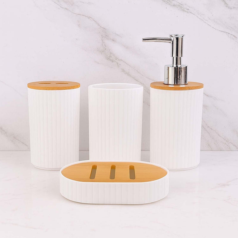 Go Hooked white ribbed plastic bathroom accessory set with soap dispenser, toothbrush holder, tumbler, and soap dish.