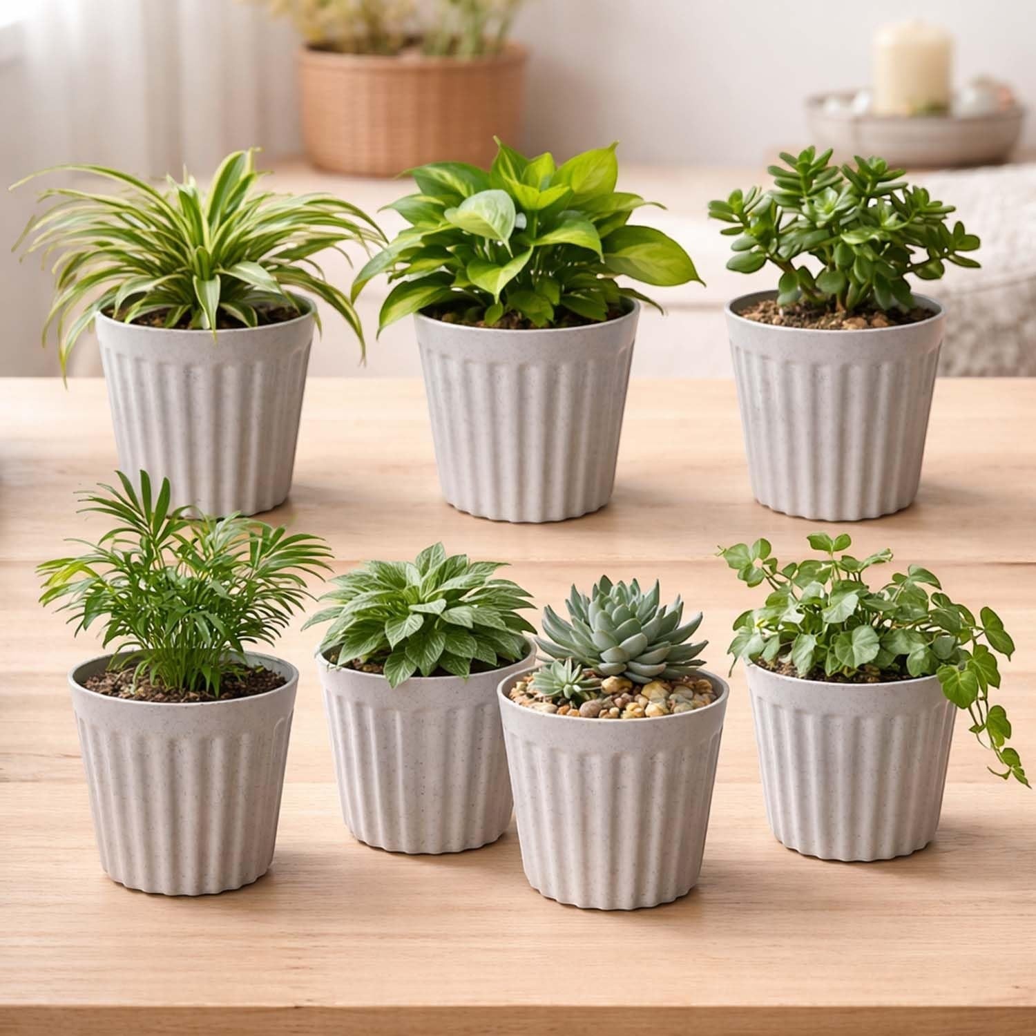 GoHooked 7-pack white ribbed plastic flower pots with marble finish, perfect for succulents and small indoor plants.