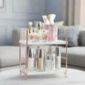 GoHooked white 2-tier metal and polypropylene shelf rack with rose gold accents, holding skincare and makeup.