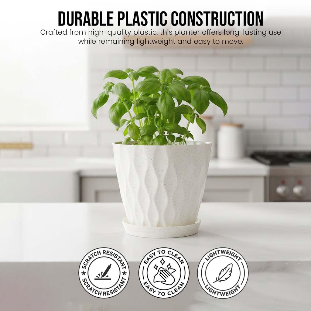 Go Hooked white speckled plastic planter with a diamond pattern and matching saucer on a white countertop.