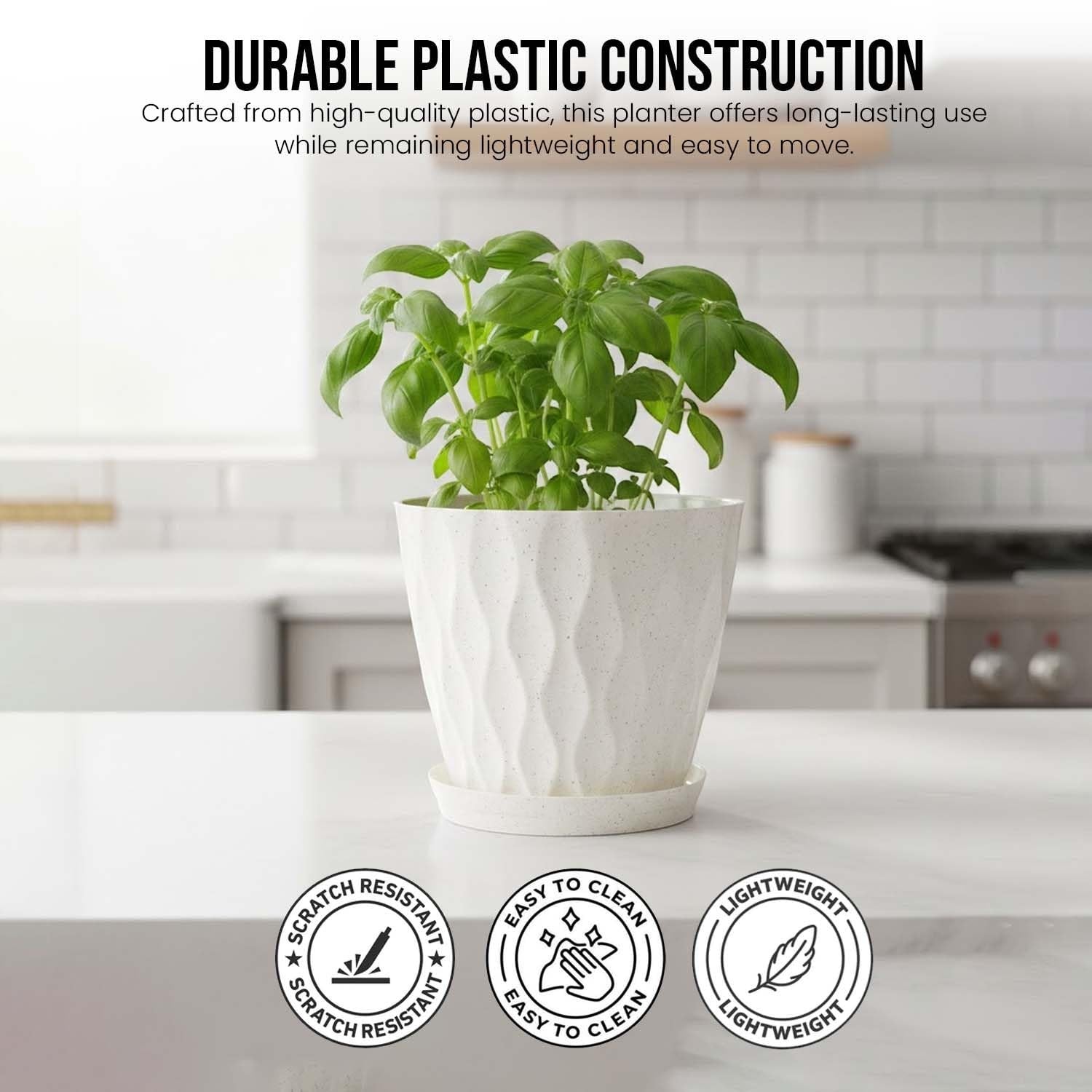 Go Hooked white speckled plastic planter with a diamond pattern and matching saucer on a white countertop.