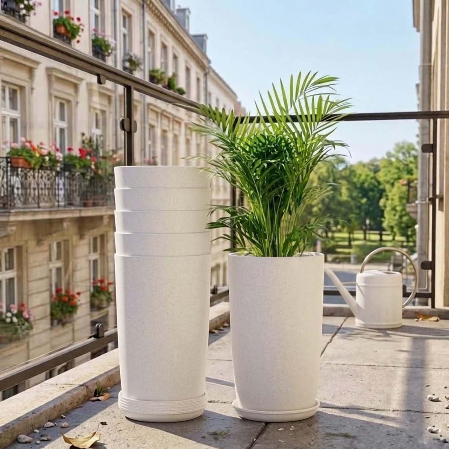 GoHooked set of 3 white speckled cylindrical plastic planters with saucers, one holding a palm plant.