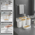 GoHooked white textured square bathroom accessory set with soap dispenser, toothbrush holder, tumbler, and soap dish.