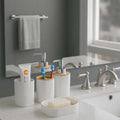 GoHooked white textured square bathroom accessory set with soap dispenser, toothbrush holder, tumbler, and soap dish.