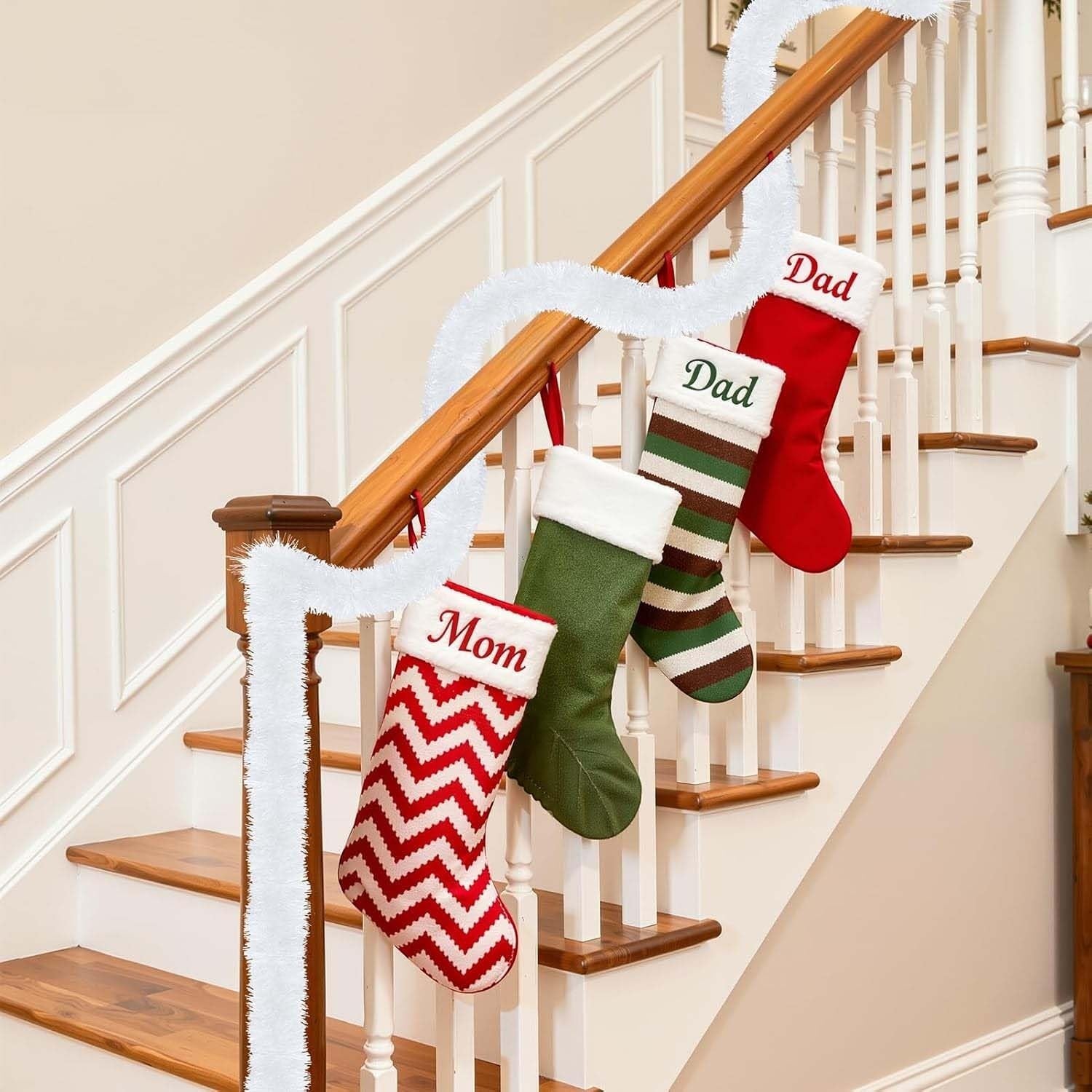 Go Hooked white tinsel garland draped on a staircase with Christmas stockings