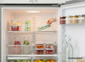 GoHooked white wire grid organizer basket holding a chocolate mint bar inside a refrigerator.
