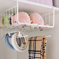 Go Hooked white wire under shelf basket with pink and green items, holding belts and a scarf.
