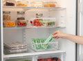 Go Hooked white wire grid storage basket bin holding mint chocolate bars in a refrigerator.