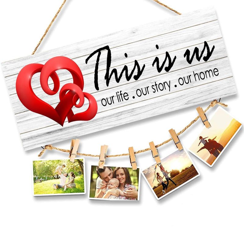 GoHooked white MDF wood wall sign with red hearts and "This is us our life . our story . our home" text, holding photos with clips.