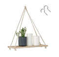 GoHooked rustic wood floating shelf with jute rope hangers, holding a plant and two white candles.
