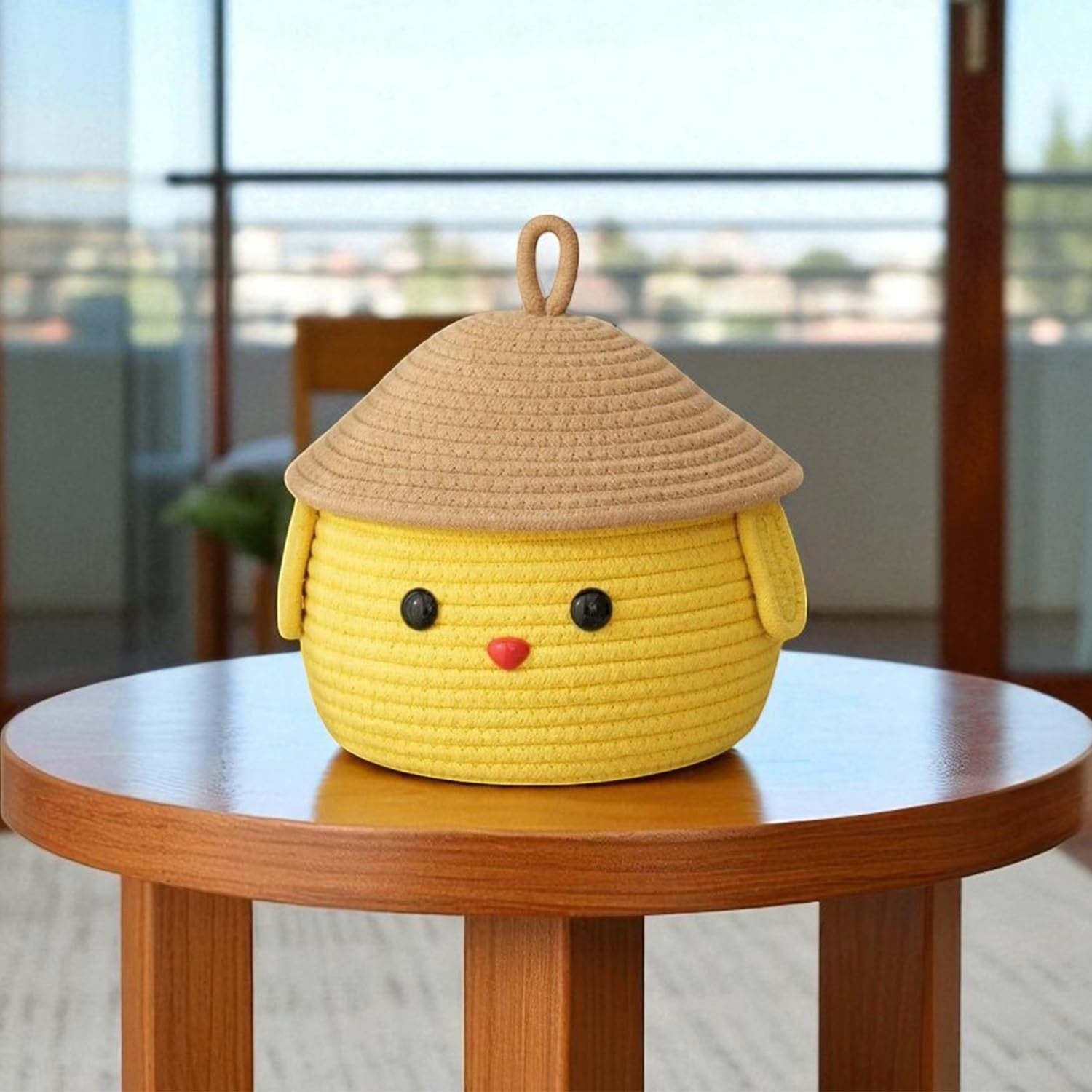 GoHooked yellow cotton rope basket with lid, featuring a cute animal face design with black button eyes and a red nose. Perfect for nursery or kids' room storage.