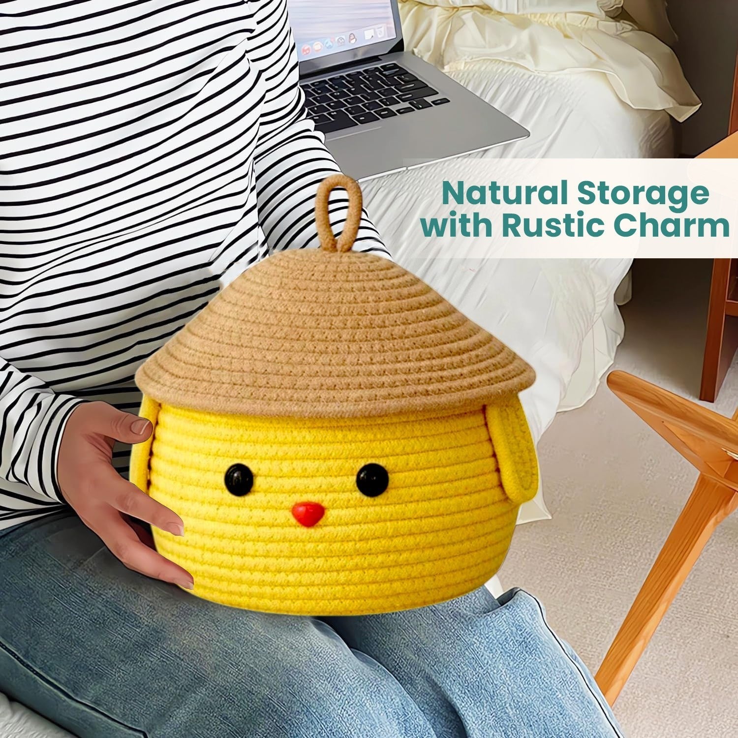 GoHooked yellow cotton rope storage basket with a cute face and lid held by a person in a striped shirt