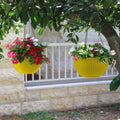 GoHooked yellow plastic hanging pot with woven texture, 7.1 inch diameter, holding vibrant flowers.