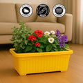 GoHooked yellow rectangular plastic planter pot with red, white, and purple flowers. Durable and weather-resistant.