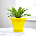 GoHooked yellow plastic planter pot with saucer, 6 inch twister design for indoor/outdoor plants.