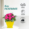 GoHooked yellow textured plastic planter pot with pink flowers and matching saucer, suitable for indoor/outdoor use.