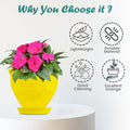 Go Hooked yellow plastic planter pot with embossed floral design and saucer, featuring pink flowers.