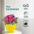 Go Hooked yellow plastic planter pot with pink flowers, includes saucer tray. Modern design, suitable for indoor/outdoor use.