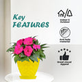 Go Hooked yellow plastic planter pot with pink flowers and saucer tray. Features indoor/outdoor use, anti-fade material, and great visual appeal.