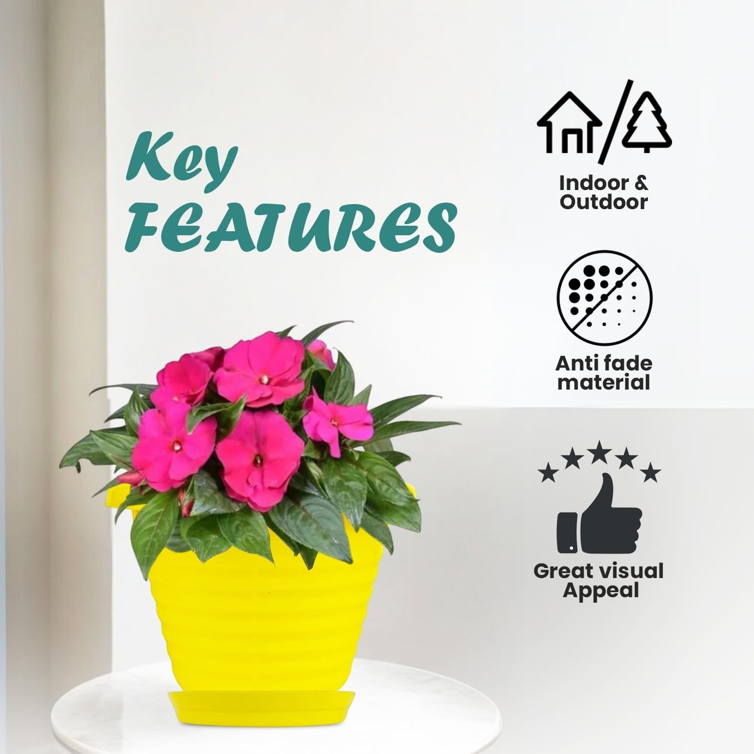 Go Hooked yellow plastic planter pot with pink flowers and saucer tray. Indoor & outdoor use, anti-fade material.