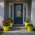 GoHooked yellow 10-inch plastic planter pots with vertical ribbing, holding plants on a front porch.