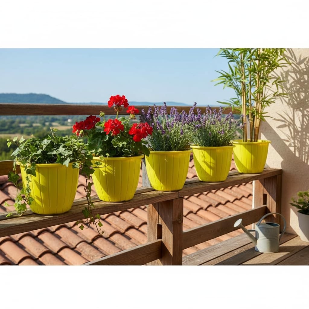 Go Hooked yellow 10-inch plastic planters with vertical ribbing, holding various plants on a wooden railing.