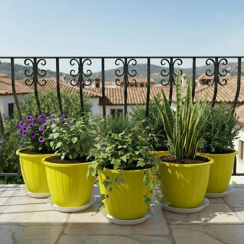 GoHooked yellow 8-inch plastic planters with white trays, holding various plants on a balcony.