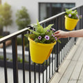 GoHooked yellow plastic railing flower pots with purple flowers and ferns, set of 5, 12-inch size.