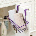 GoHookedHere purple mild steel hanging storage basket with two rolled towels inside, over a white cabinet door.