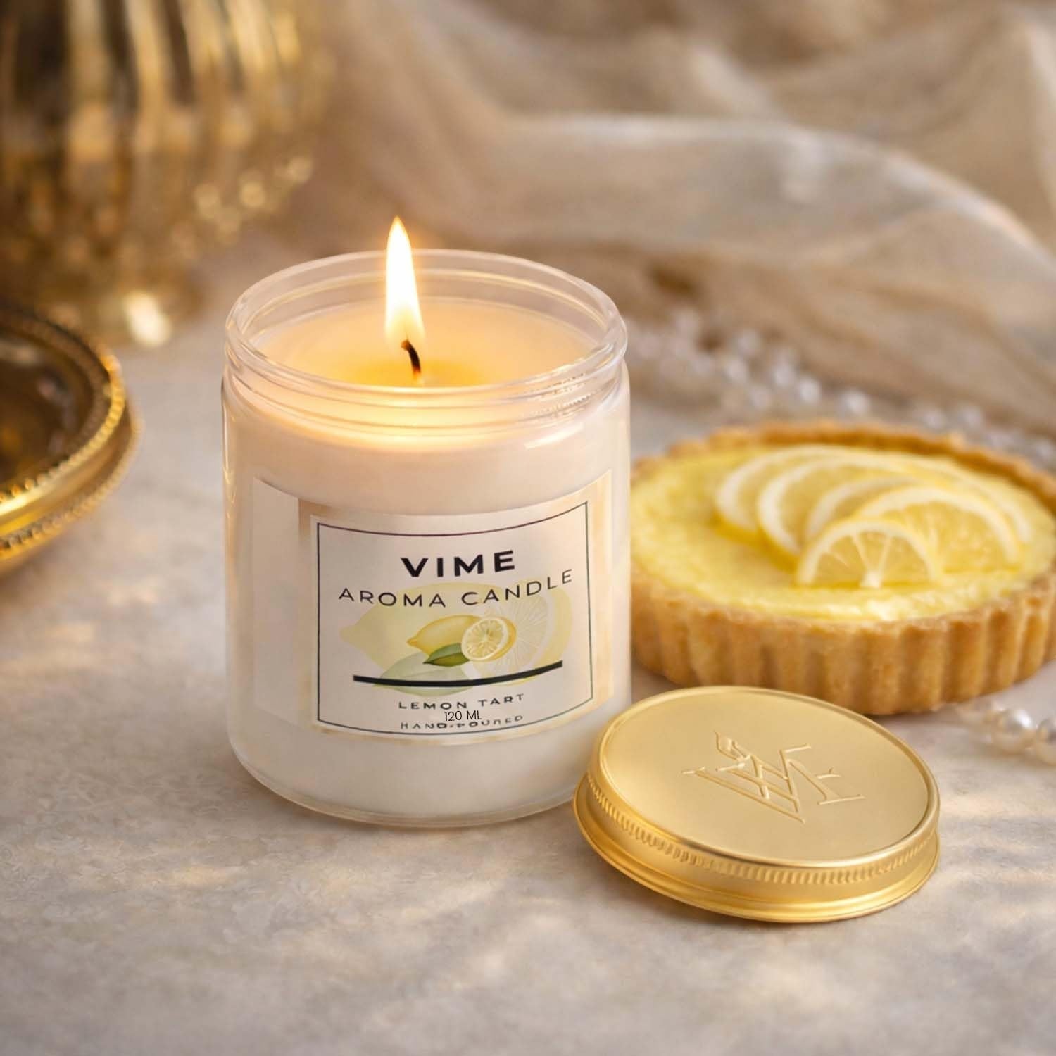 ViMe white aroma candle in a glass jar with a lemon tart and gold lid. Scented with Lasting Lily.
